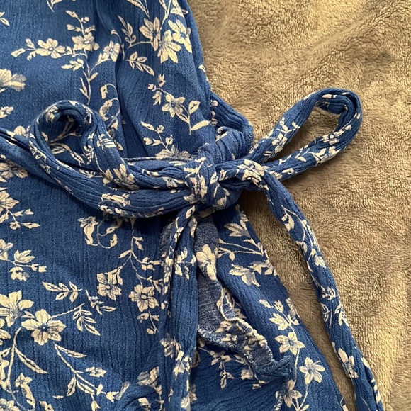 blue and white dress with a wrap-around waist - Picture 2 of 3